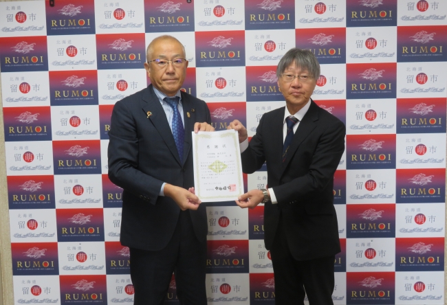 留萌市長と光栄運輸株式会社神様の写真